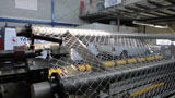 Chain link weaving machine