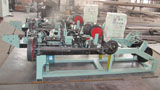 Reverse twist barbed wire machine