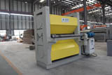 Expanded mesh flattening machine